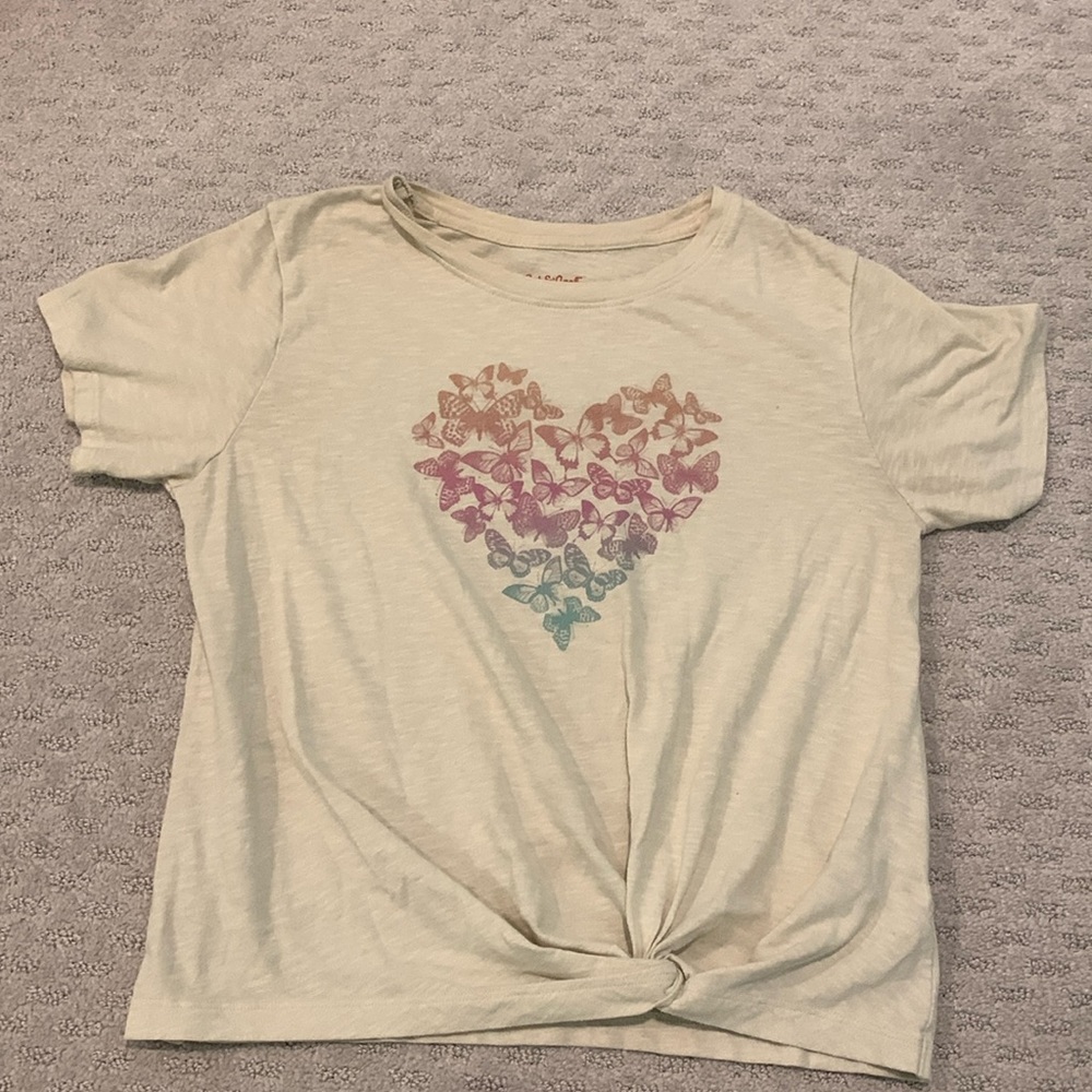 Cream Based. Multi Colored butterfly’s in heart shape.